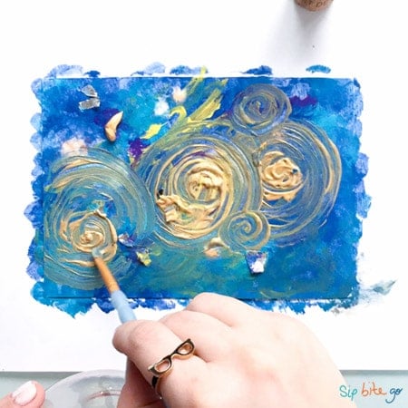 The process of creating a home-made trendy abstract modern pattern painted  with a brush of acrylic blue multi-colored resin on a round wooden board  14161668 Stock Photo at Vecteezy