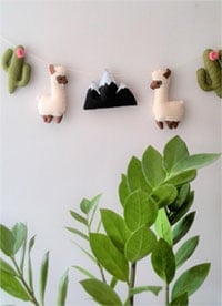 Cactus and llama nursery garland with felt llamas for a baby's room or to use as nursery bunting by Etsy shop SweeToysBaby