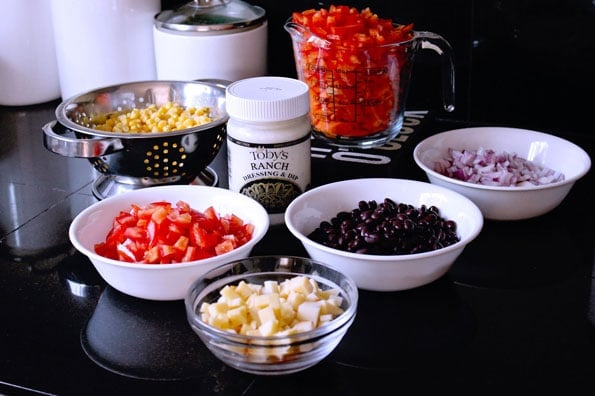 small bowls of ingredients for Mexican corn salad