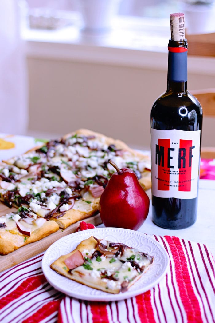 Merf wine cabernet sauvignon onions on pear and goat cheese flatbread topped with caramelized onions, ham and cheddar