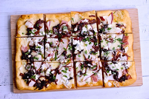 Pear and goat cheese flatbread with caramelized onions and ham