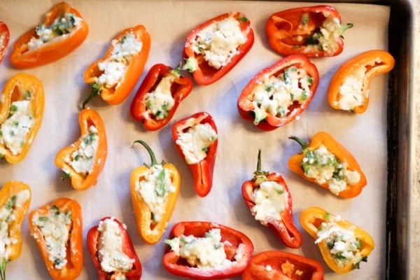 sheet tray at a party with stuffed mini sweet peppers