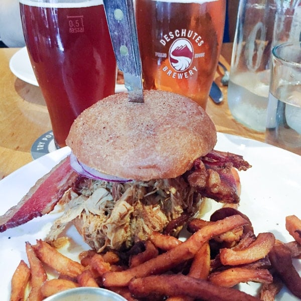 Deschutes craft beer and a pulled pork sandwich with sweet potato fries from the lunch menu