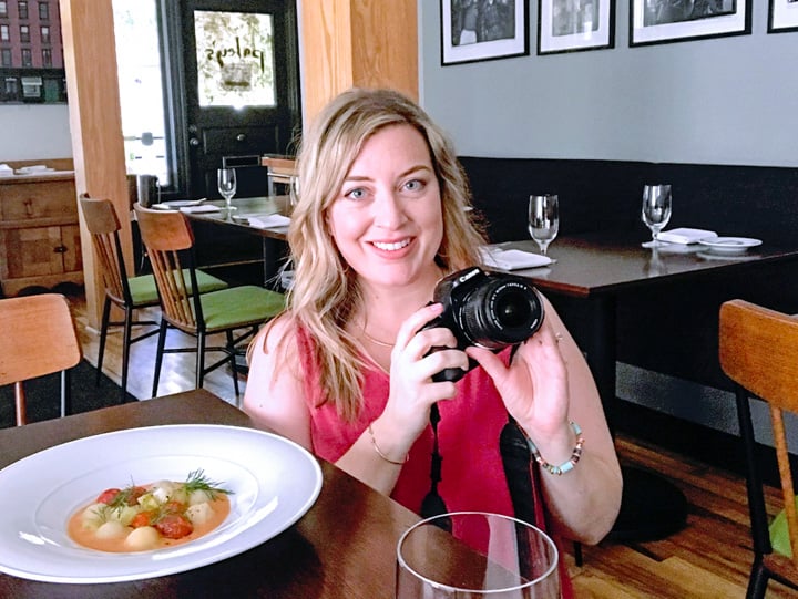 Portland restaurant influencer Jenna Passaro at Paley's Place taking social media photos for Instagram