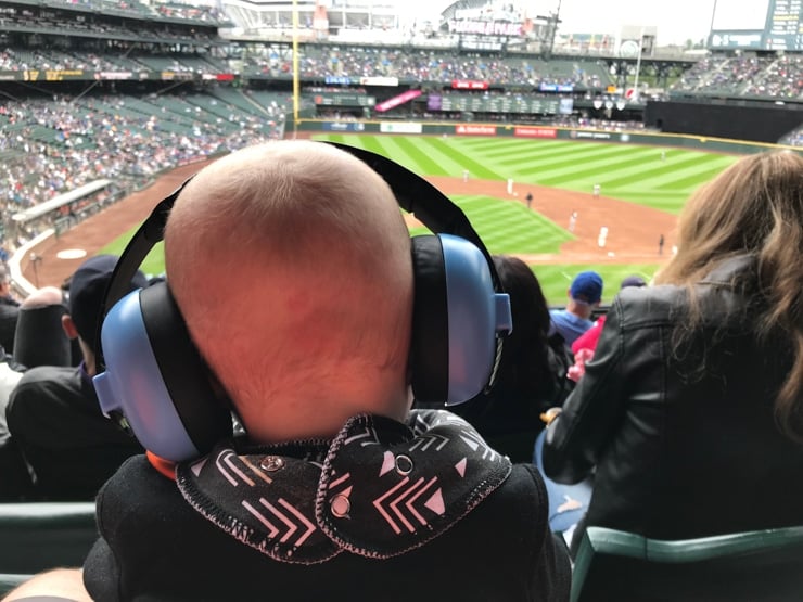 baby noise proof canceling ear muffs at a baseball game