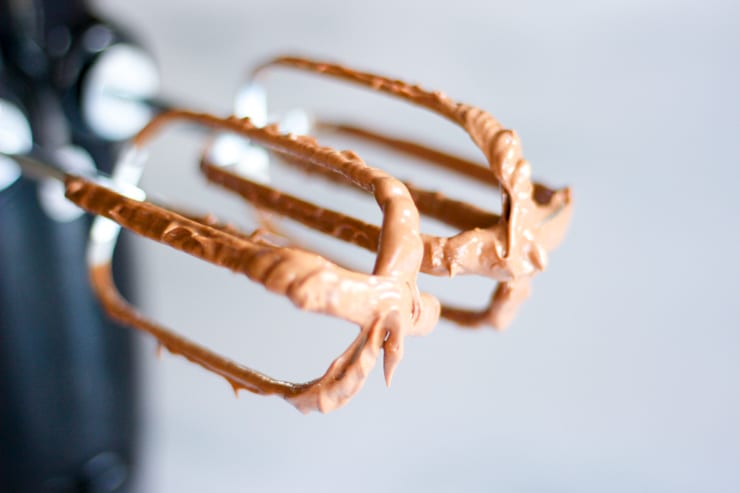 chocolate frosting on a hand mixer