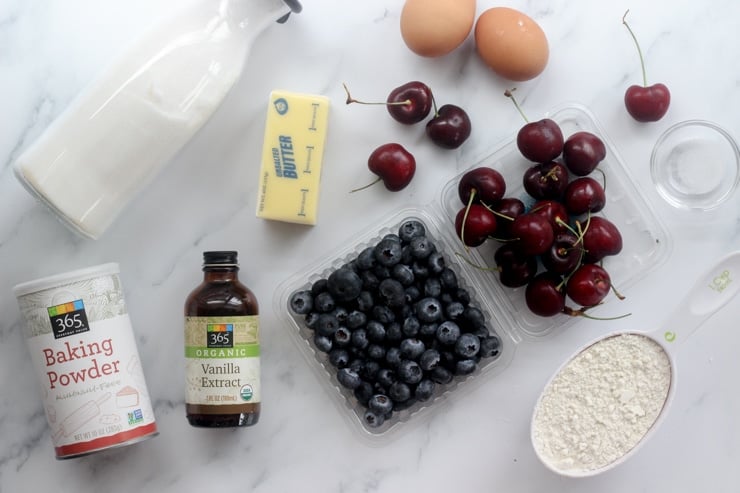 Ingredients for making fresh blueberry and cherry cake bars