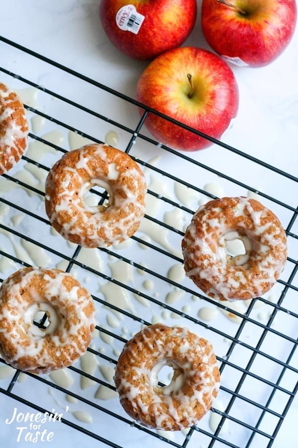 apple doughnuts on a cooling rack