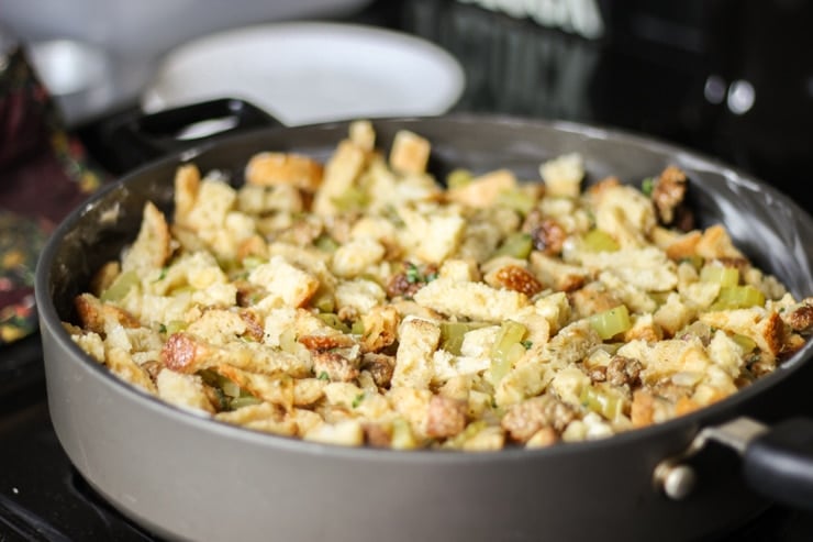 sausage, celery, onion and bread mixed together in skillet