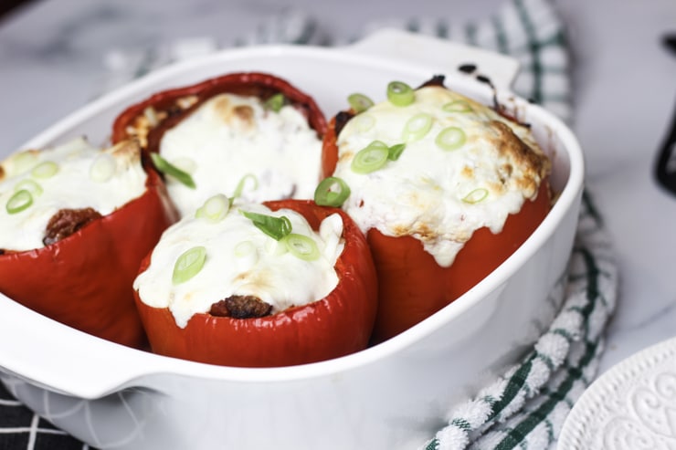 green onion topped Italian stuffed peppers with mozzarella