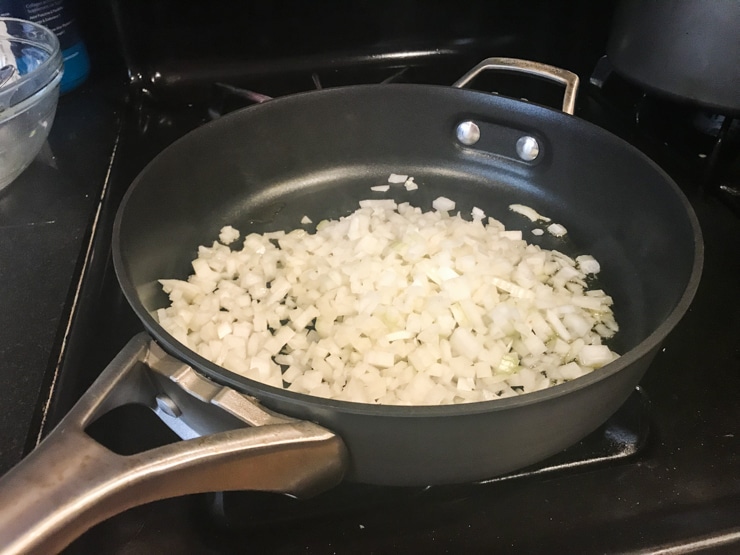 sautéing onion and olive oil in a pan 