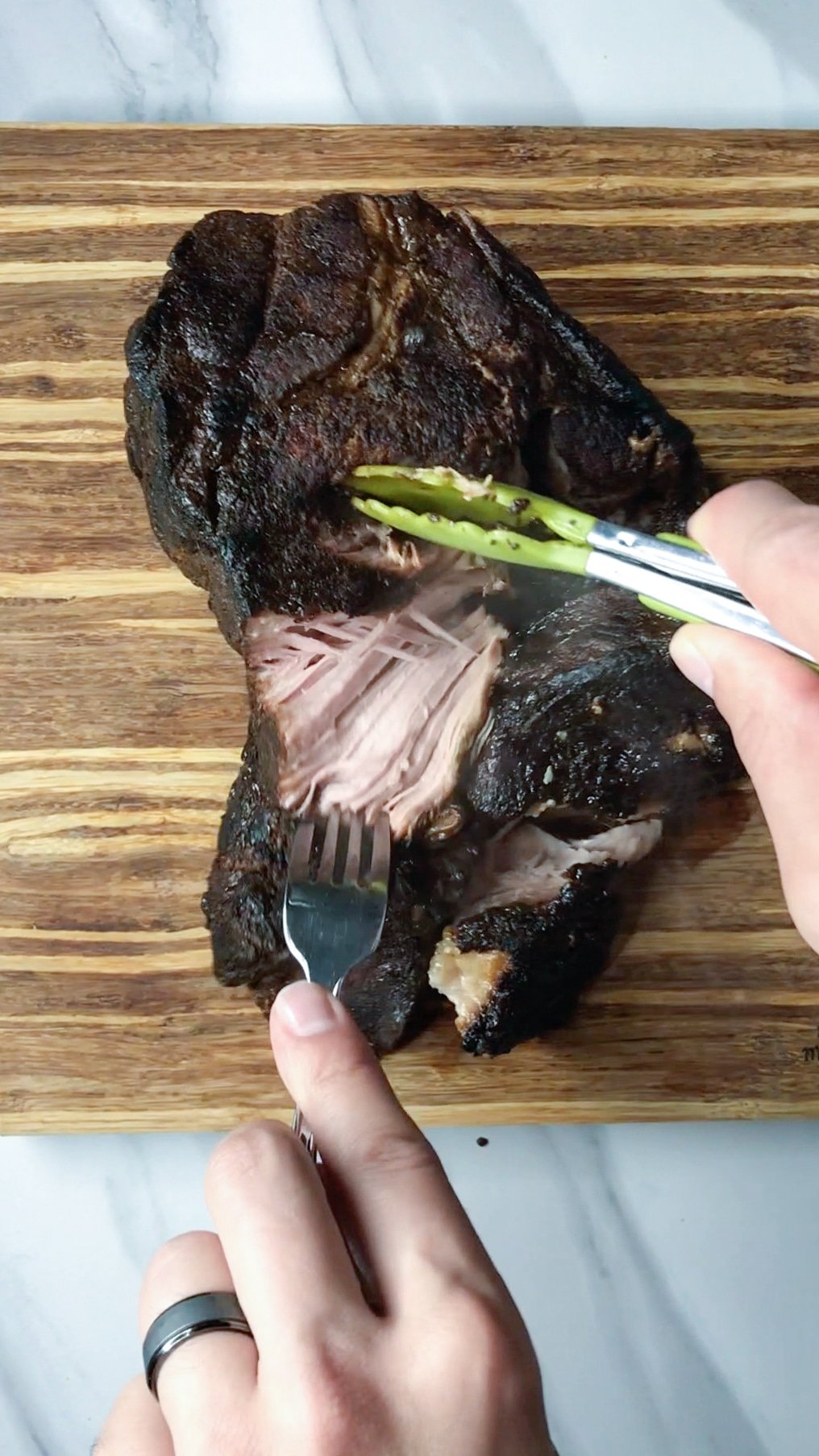 pulling apart sous vide pork butt