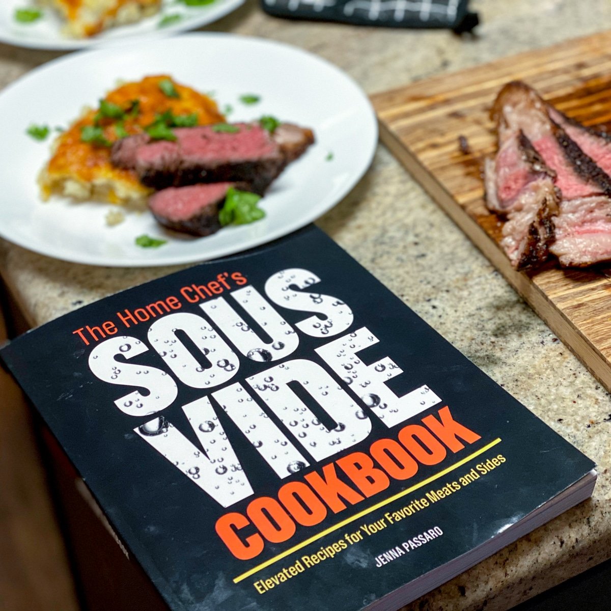 the home chef's sous vide cookbook by Jenna Passaro with ny strip beef
