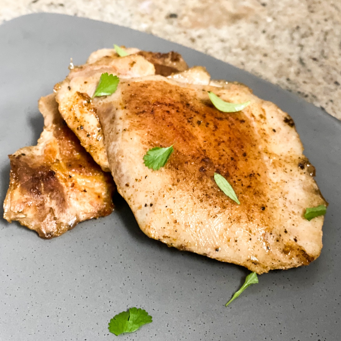 sous vide chicken thighs with fresh herbs grown for cooking