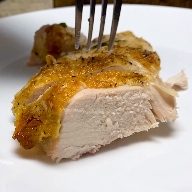 Showing moist chicken breast from spatchcocking then roasting chicken in the oven