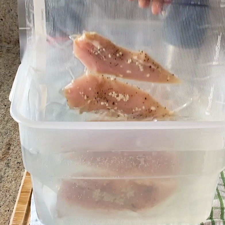 adding sous vide chicken to the water