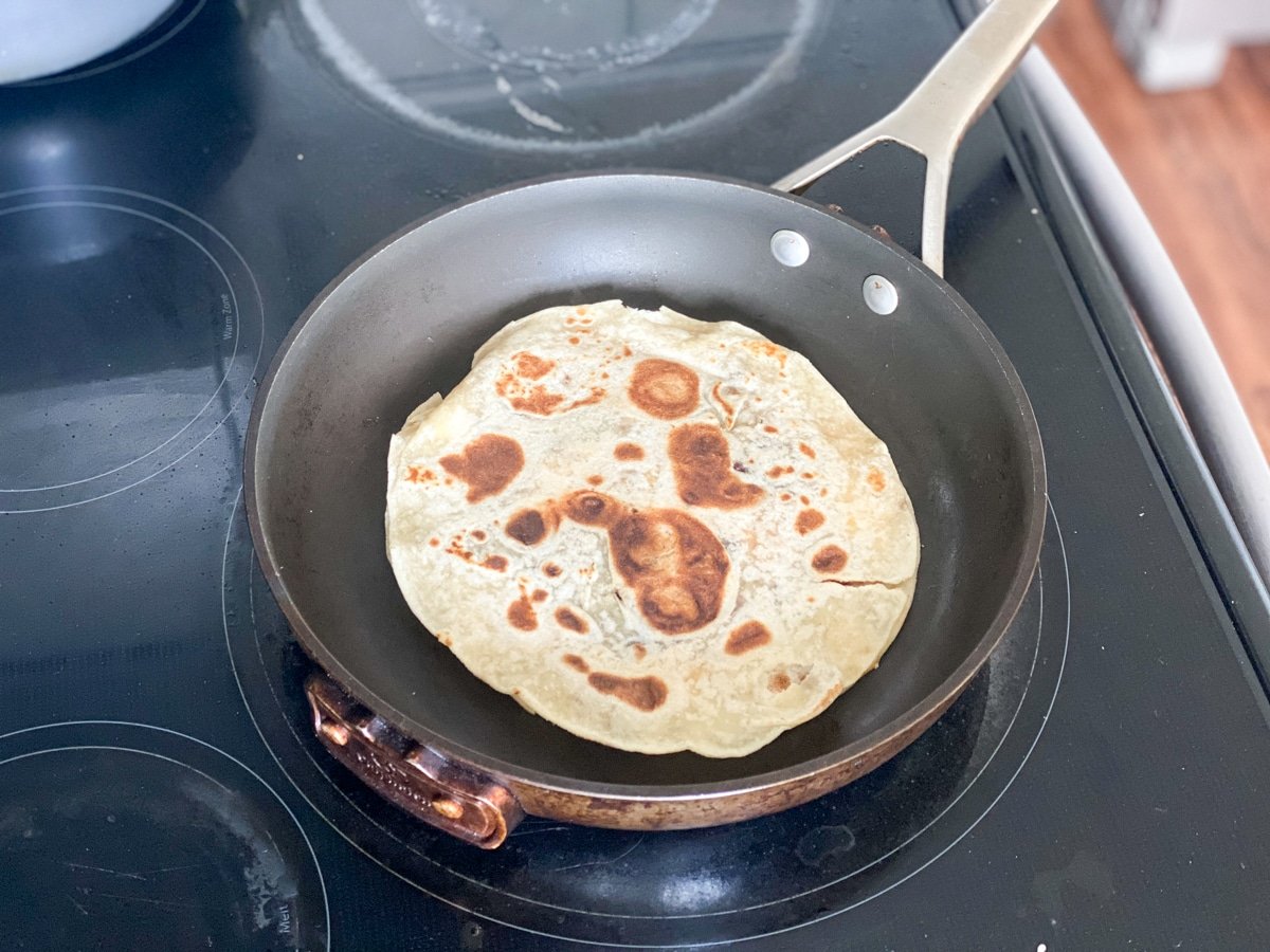 cooking a quesadilla on the stove