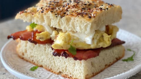 https://sipbitego.com/wp-content/uploads/2020/07/Cafe-Style-Focaccia-Breakfast-Sandwich-With-Bacon-And-Egg-Sip-Bite-Go-1-480x270.jpg