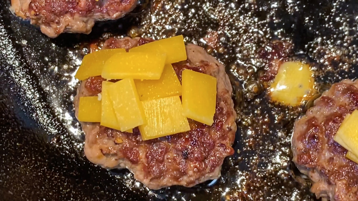 cooking ground beef sliders with cheese
