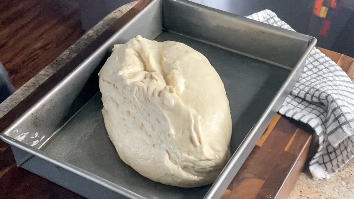ball of focaccia in a greased pan