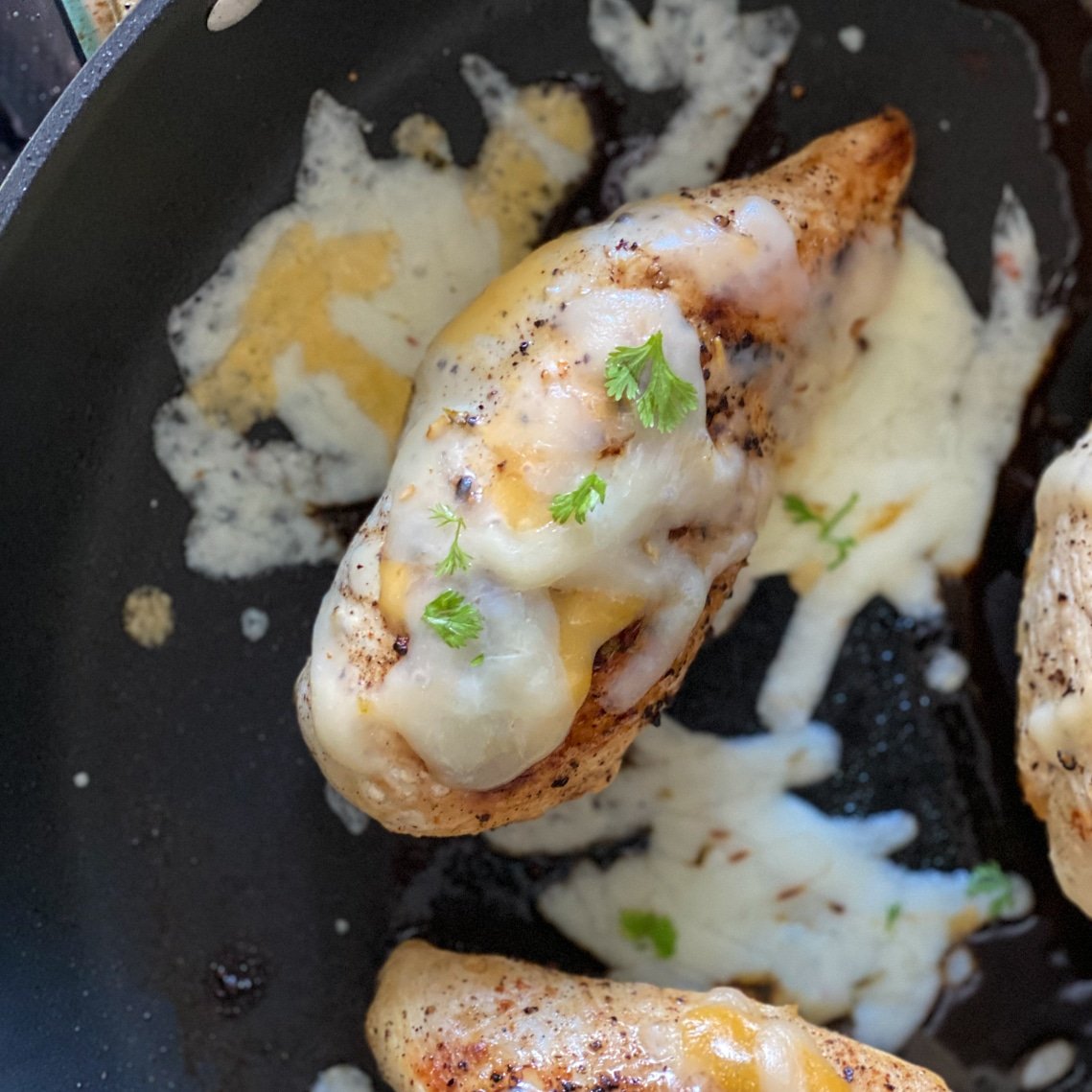 simple chicken dinner with cheese and herbs