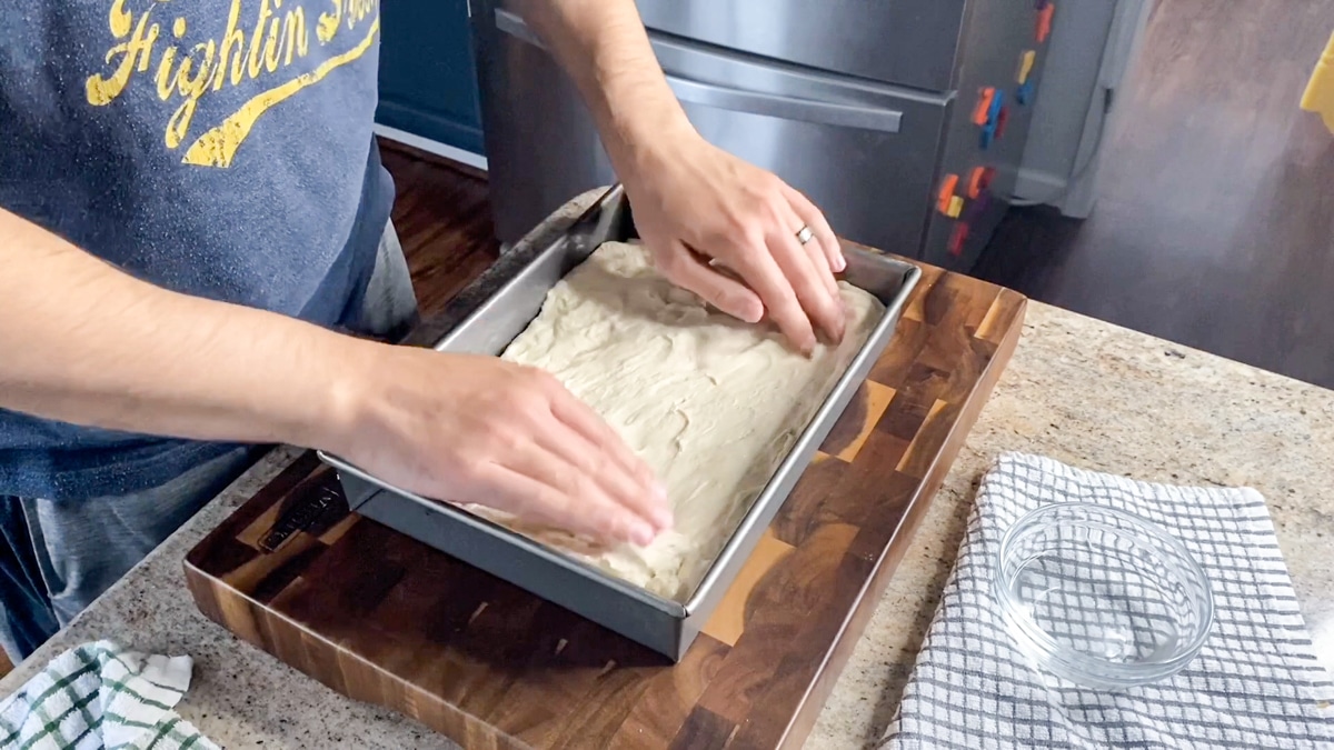 stretching focaccia dough by hand