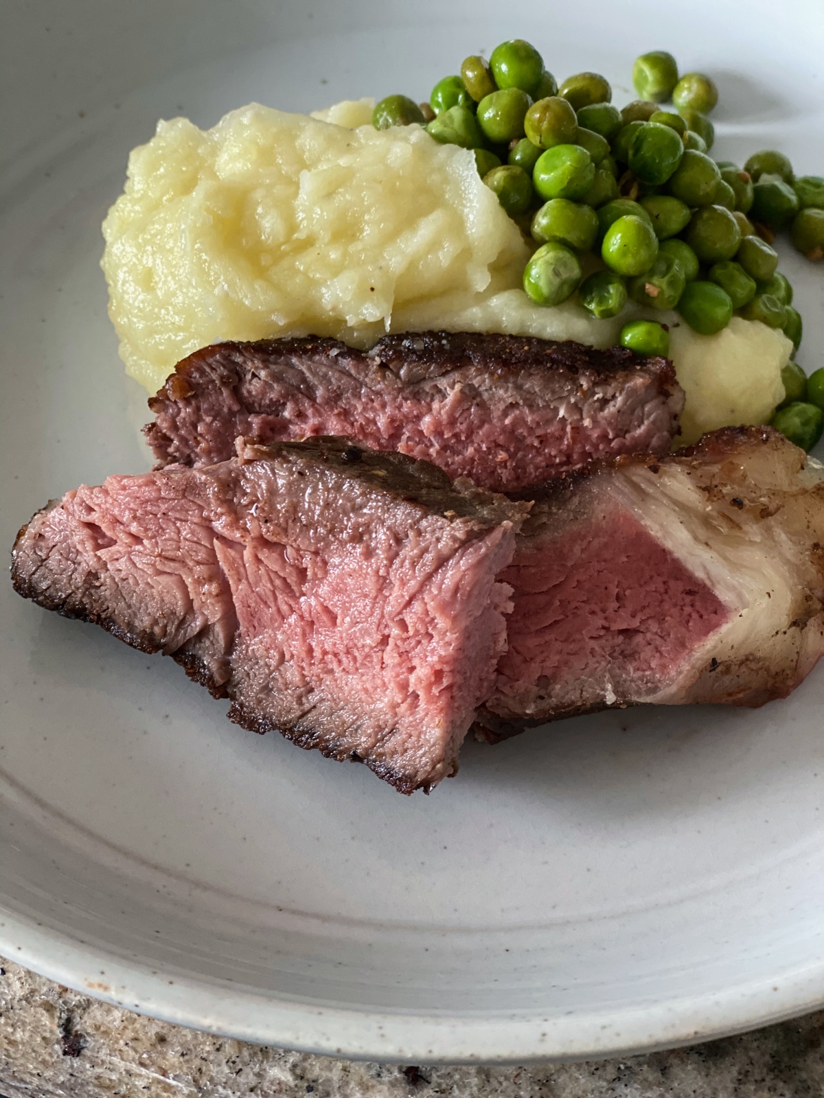 sous vide New York strip steak for dinner with mashed potatoes