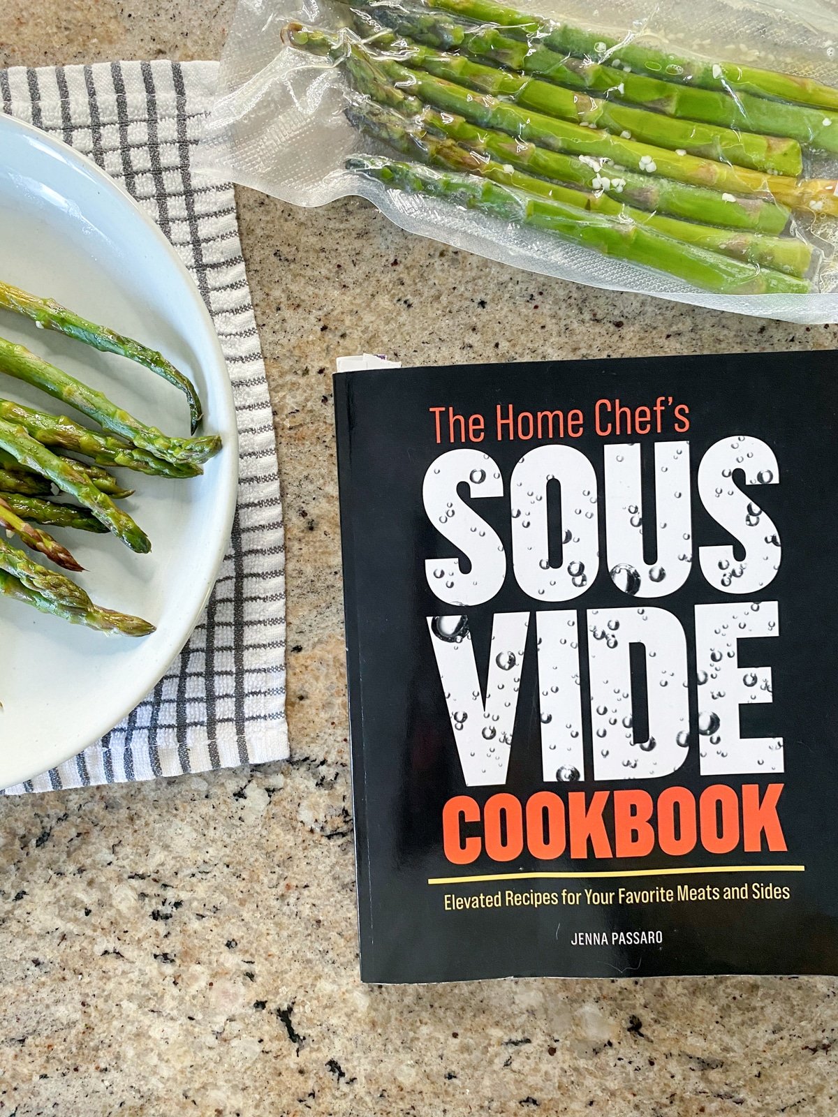 the home chef's sous vide cookbook with sous vide asparagus in vacuum sealed bag