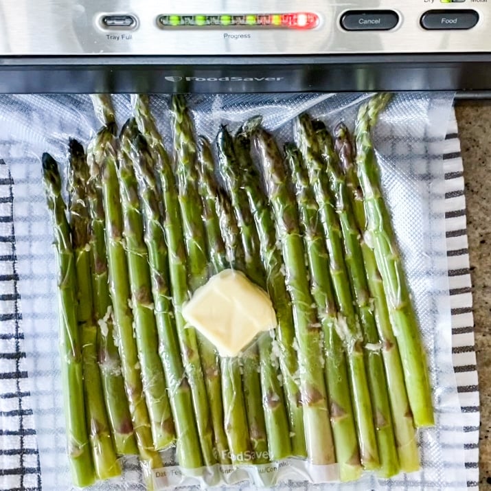 Demonstrating How To Vacuum Seal Asparagus For Sous Vide Cooking