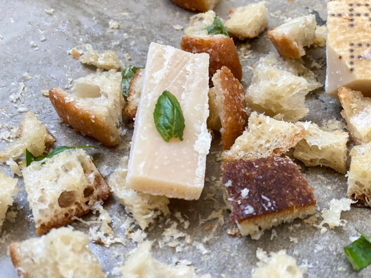 Parmesan cheese block and croutons