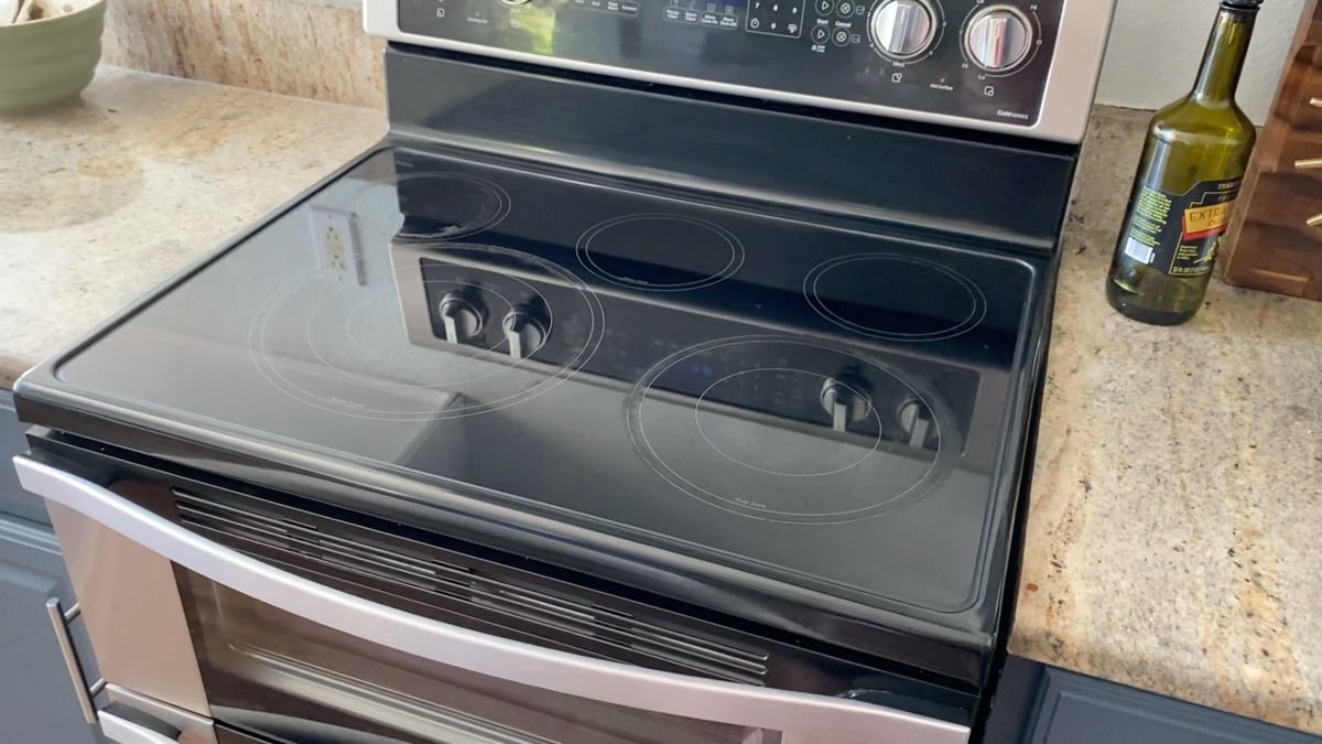 Clean flat black glass stove top.