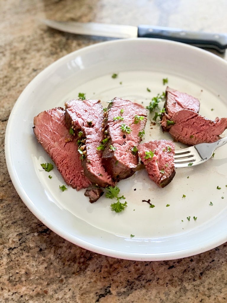 Sous Vide Tenderloin Steaks with Asparagus and Onions