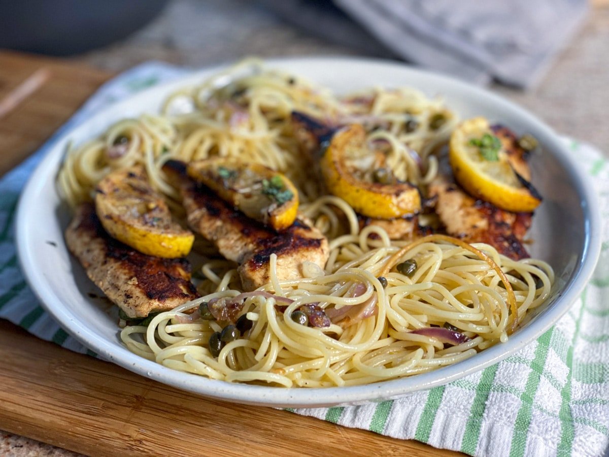 cooked spaghetti with sous vide chicken lemon wedges