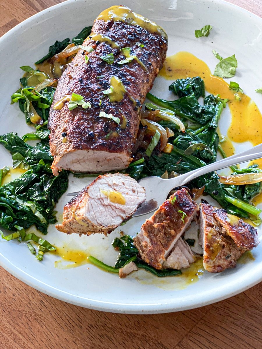 medium pork tenderloin sous vide style with spinach and bbq sauce