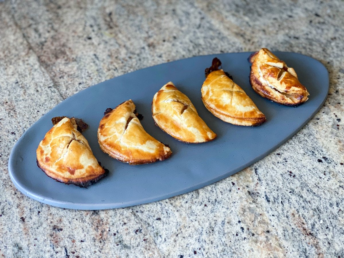 mini apple pie turnovers on a serving platter