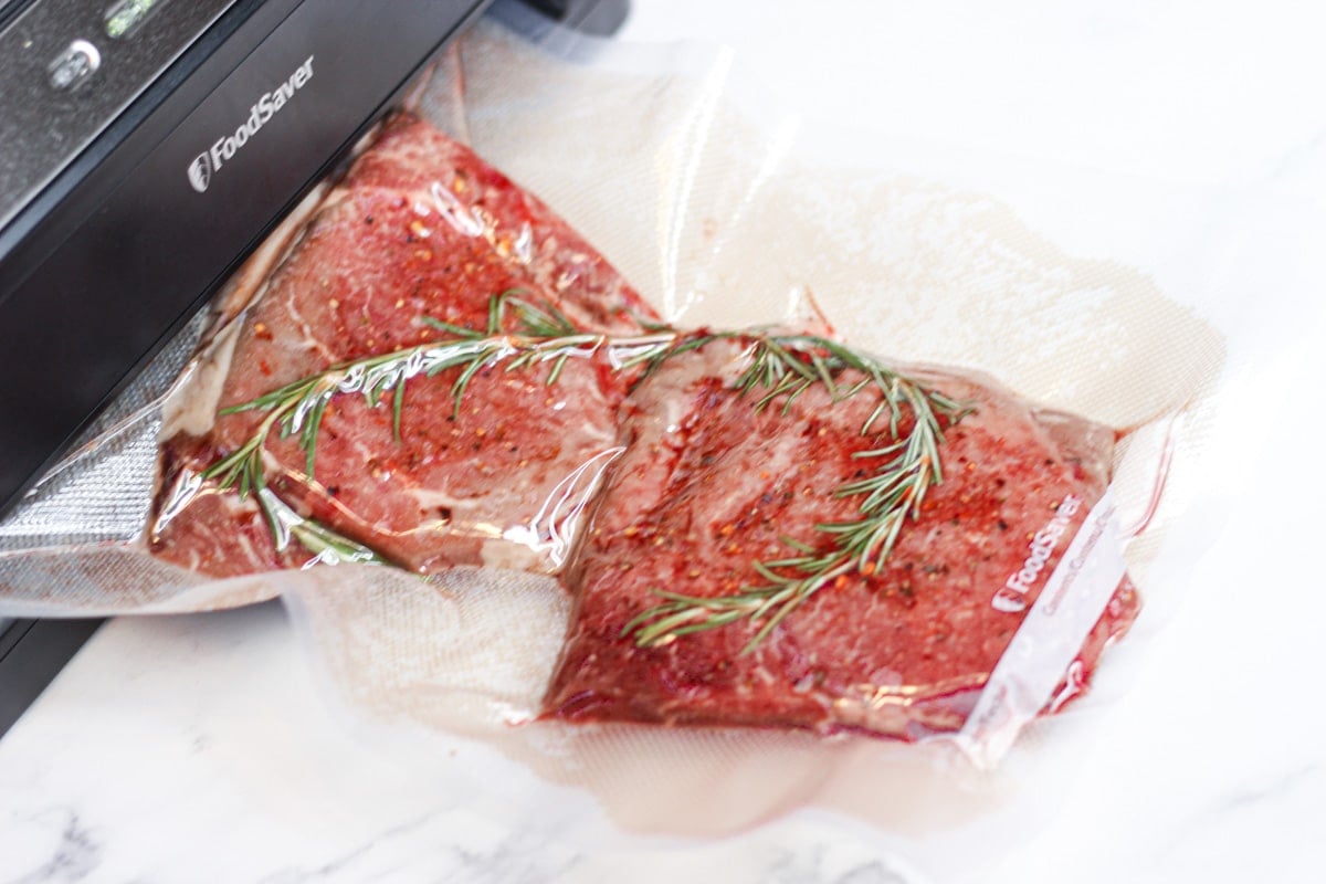 vacuum sealed vide beef round steak with herbs and spices