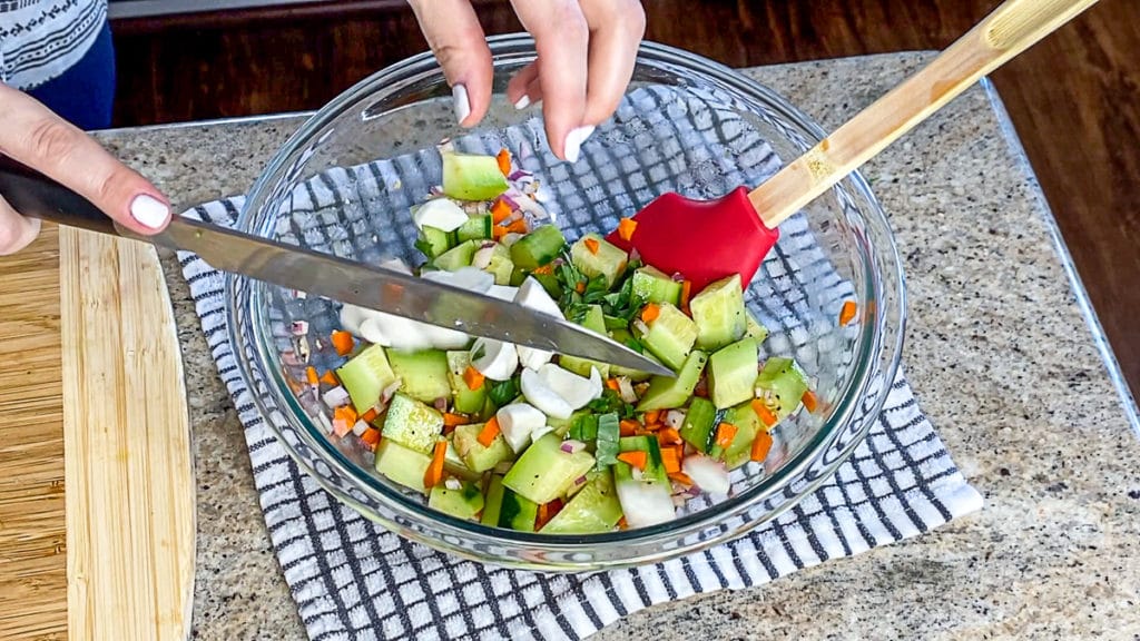 making a fresh salad with aerogarden herbs