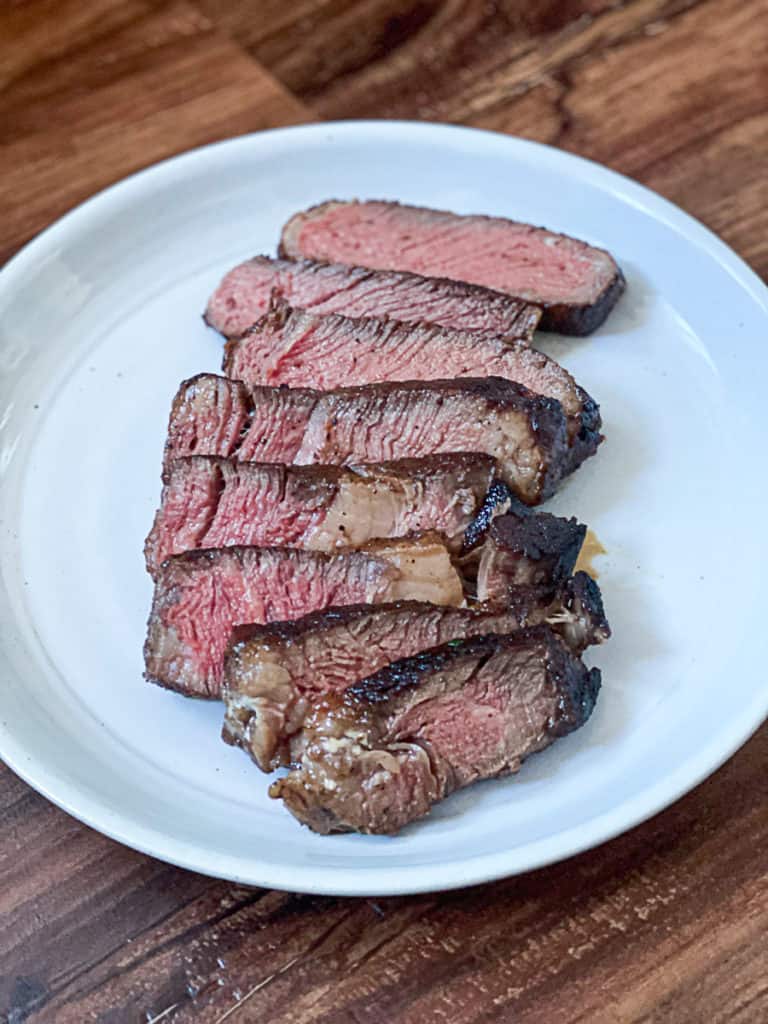 sliced sous vide steak on a table