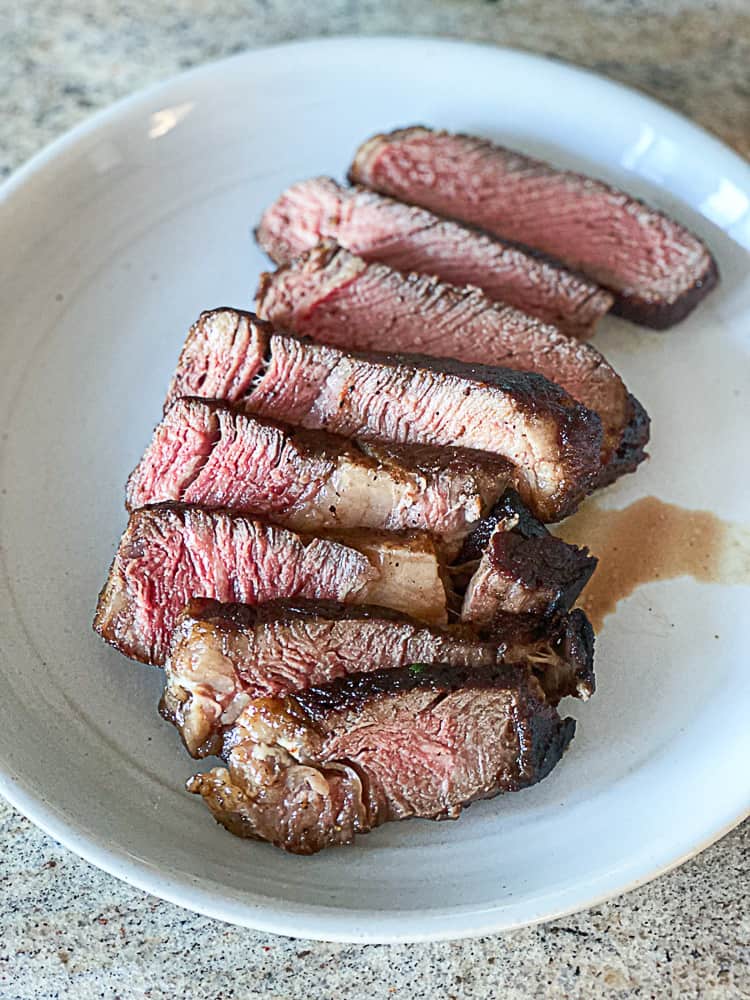 Top shot of sous vide steak on a plate.