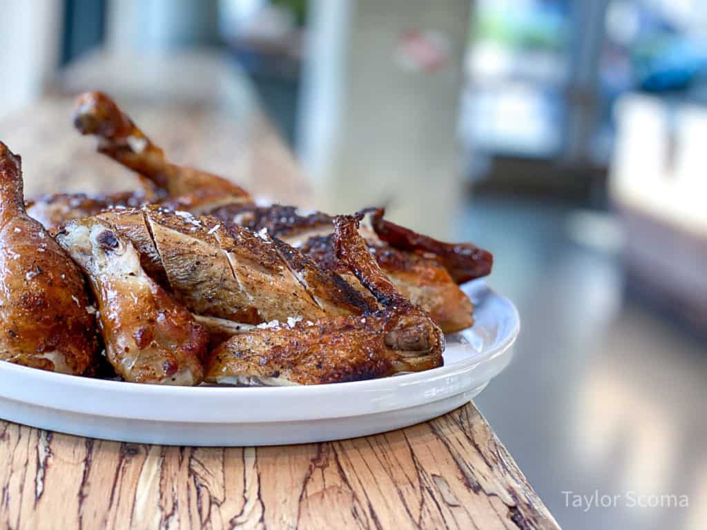 plate with cooked meat on a long table