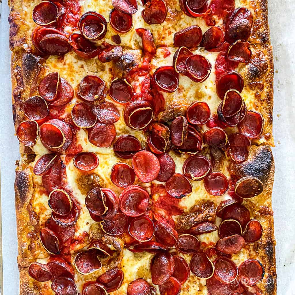 pepperoni pizza sliced into squares