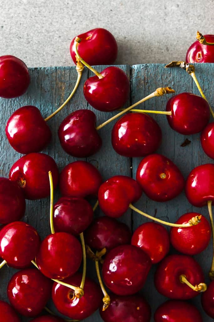 Top shot of spring cherries on a table.