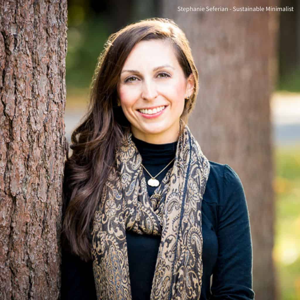 Headshot of woman next to a tree.