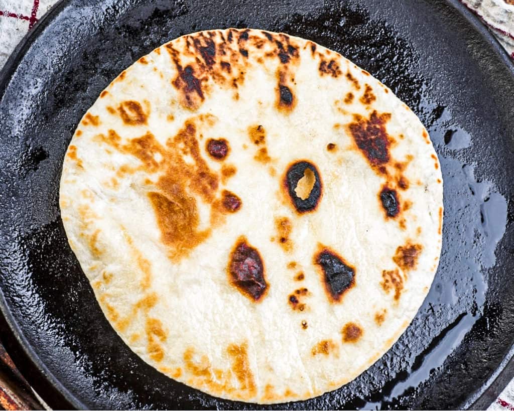 Top down shot of cooking a flour tortilla.