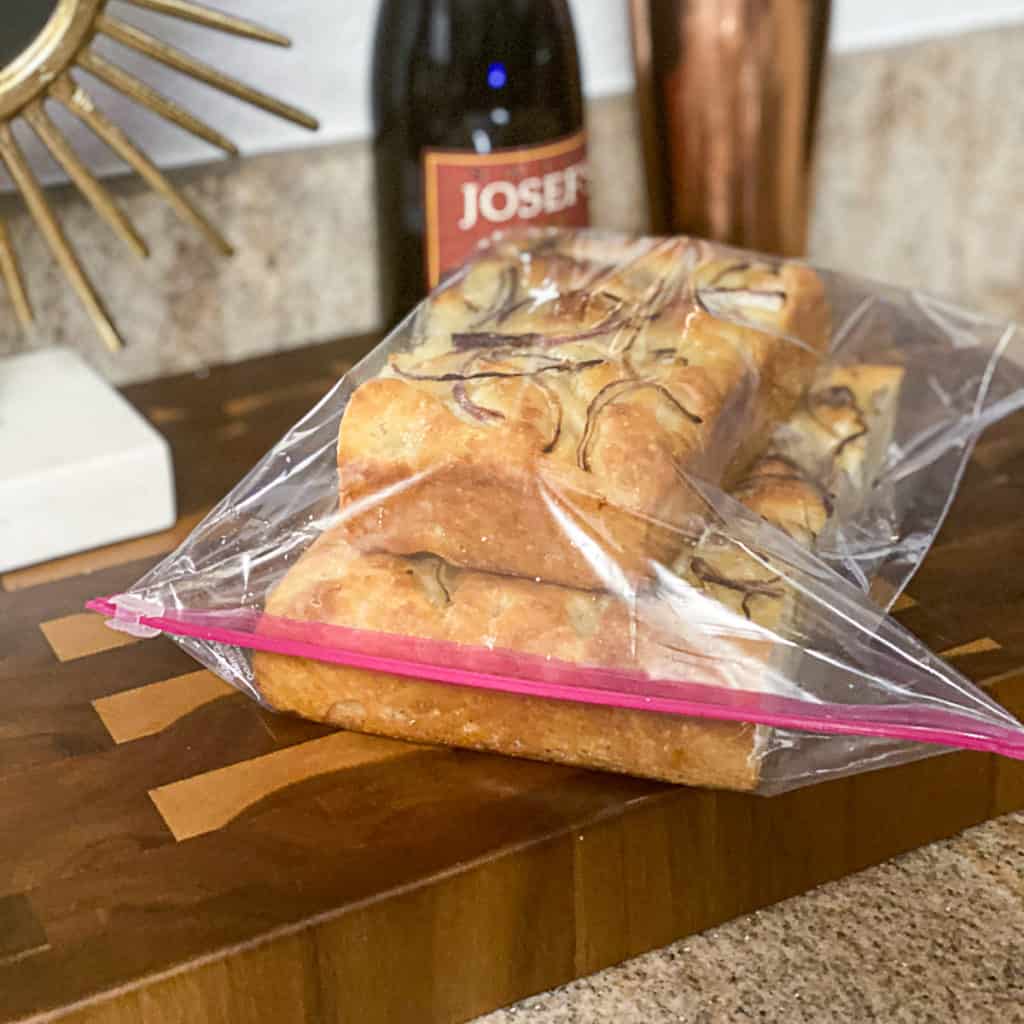 Side shot of ziplock bags of frozen bread.