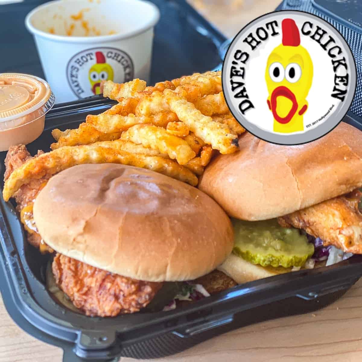 Logo of Dave's Hot Chicken restaurant with menu items including nashville style chicken sandwiches and sauce and sides.