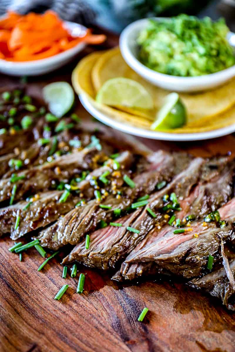 Image of marinated steak with taco ingredients.