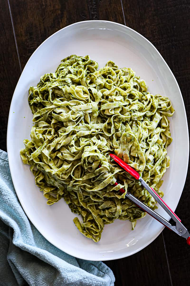 https://sipbitego.com/wp-content/uploads/2021/05/Homemade-Pasta-Recipe-Fettuccine-Linguine-Spaghetti-Sip-Bite-Go-fresh-pasta-fettuccine-noodles-in-pesto-sauce-on-a-serving-platter.jpg