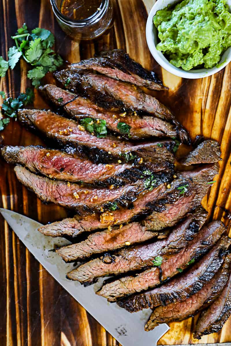 Top down shot of Flank Steak Marinated then seared in a cast iron skillet.