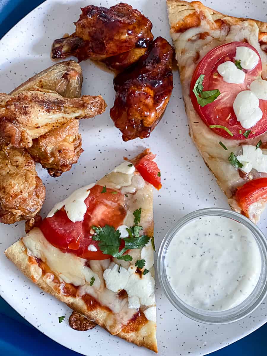 Top down shot example of convection oven pizza recipes vs air fryer wings recipes.